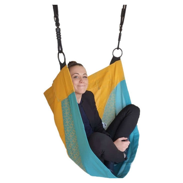person swinging gently in a cacoon sensory swing in nz