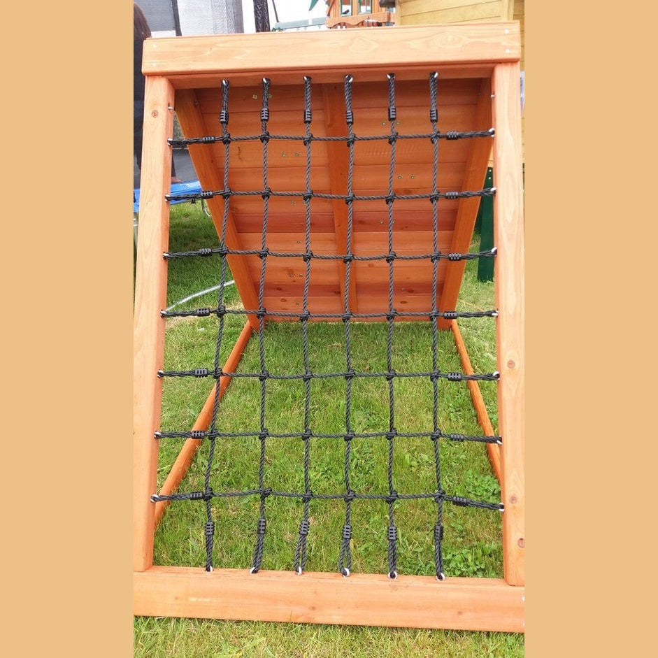 Wooden climbing frame with a scramble net on a grassy area