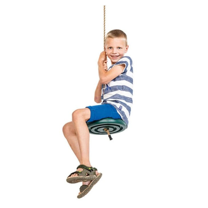 child sitting on a green disc swing