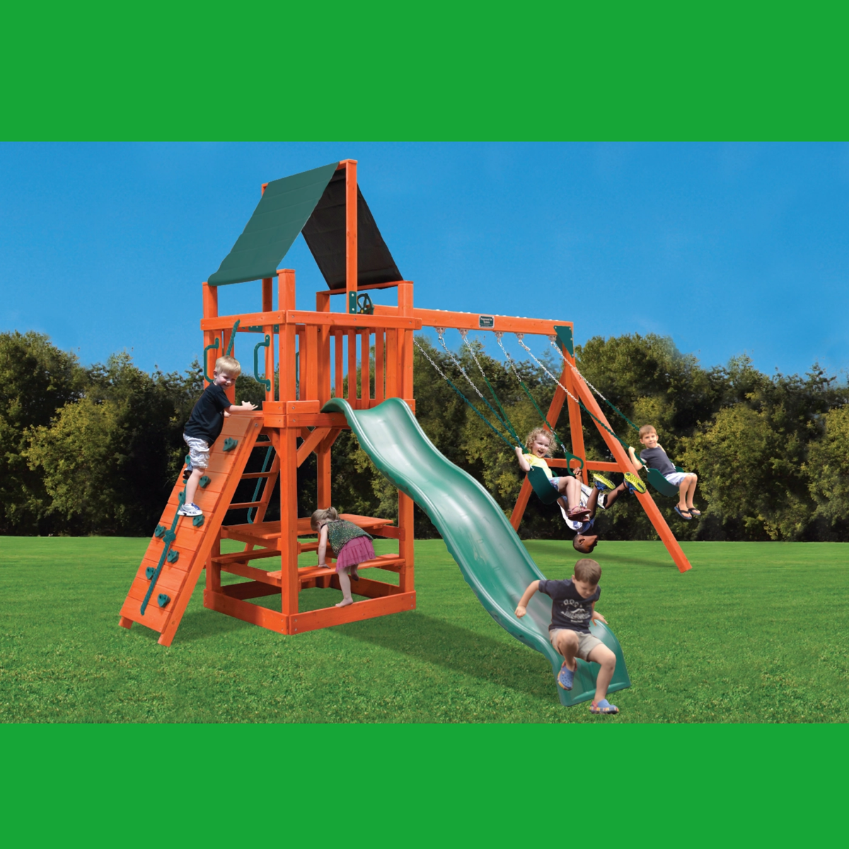 An outdoor backyard playset with an orange wooden climbing tower, green slide, hanging swings, and a green roof, shown with children playing on a grassy lawn under a blue sky.