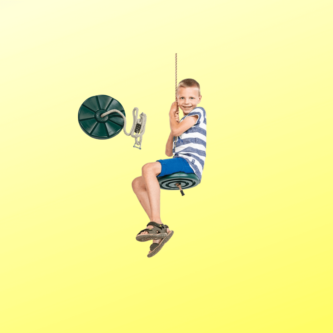 Boy swinging on green monkey swing