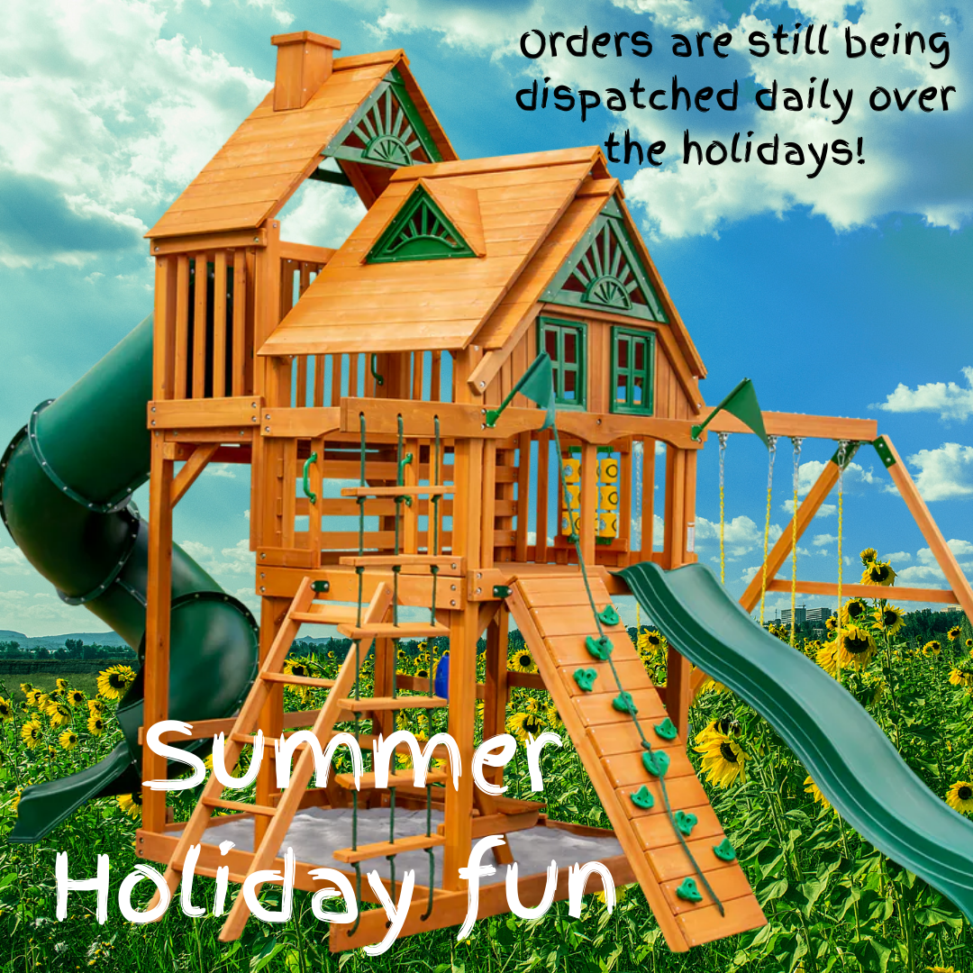 Wooden playground with slides and swings in a field.