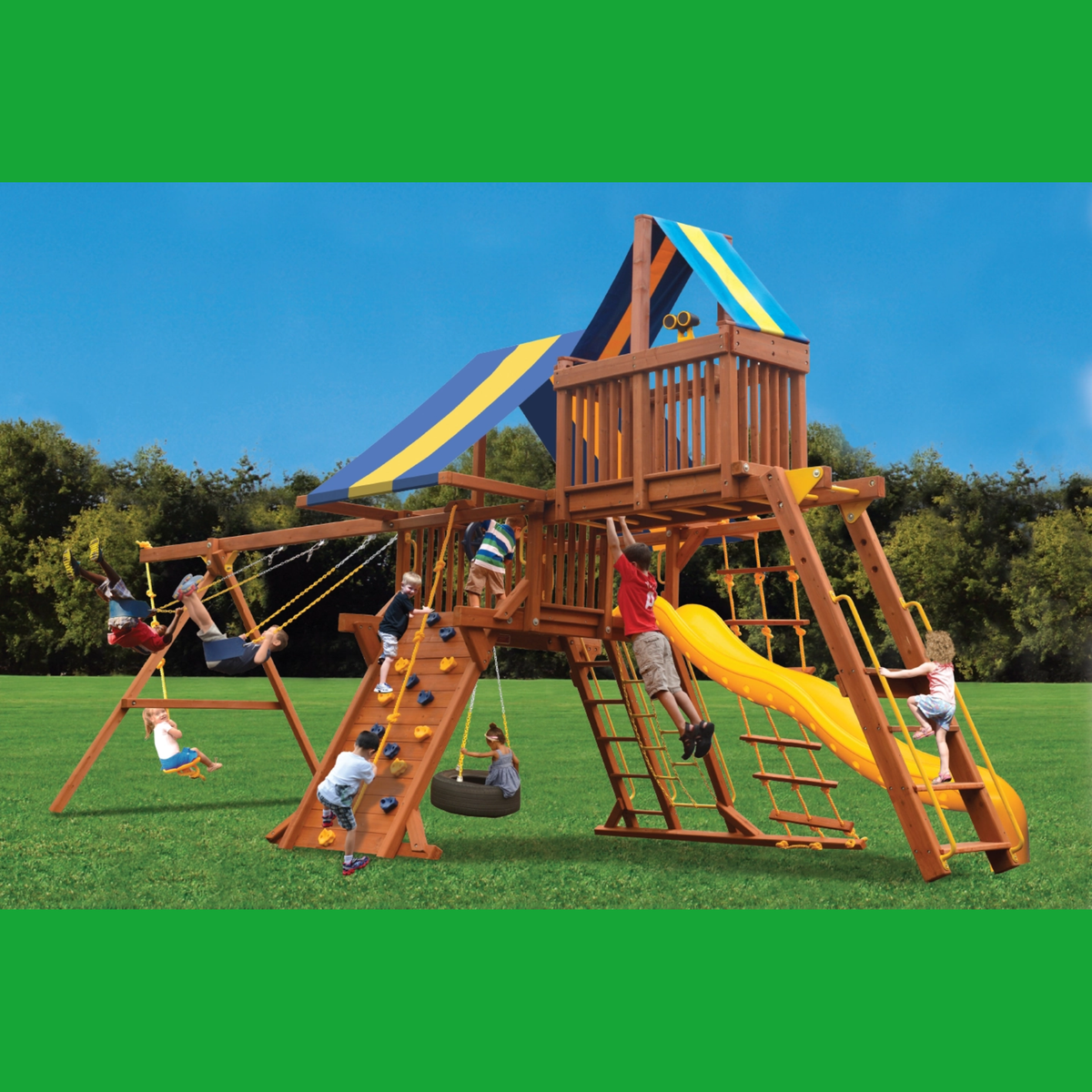 Children playing on a wooden playground set with slides and swings against a clear blue sky.