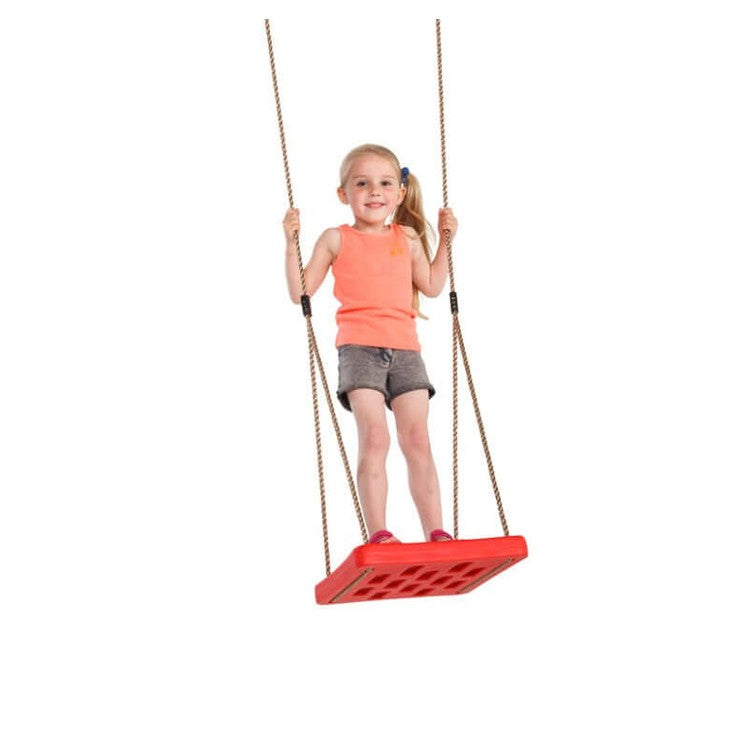 girl standing and swinging on a foot swing in nz