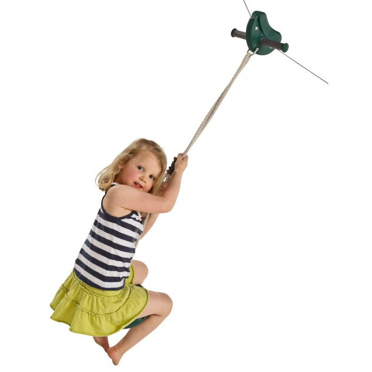 girl using a green zip line and monkey swing