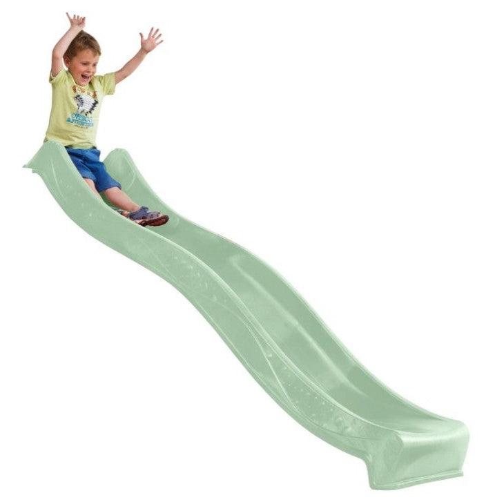 A child sliding down a long, curved, mint green slide