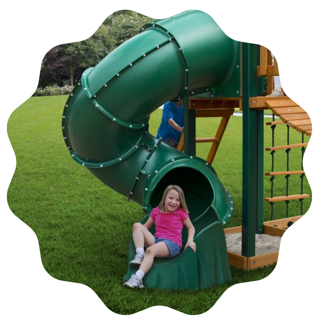 girl at the bottom of a twirly green tube slide