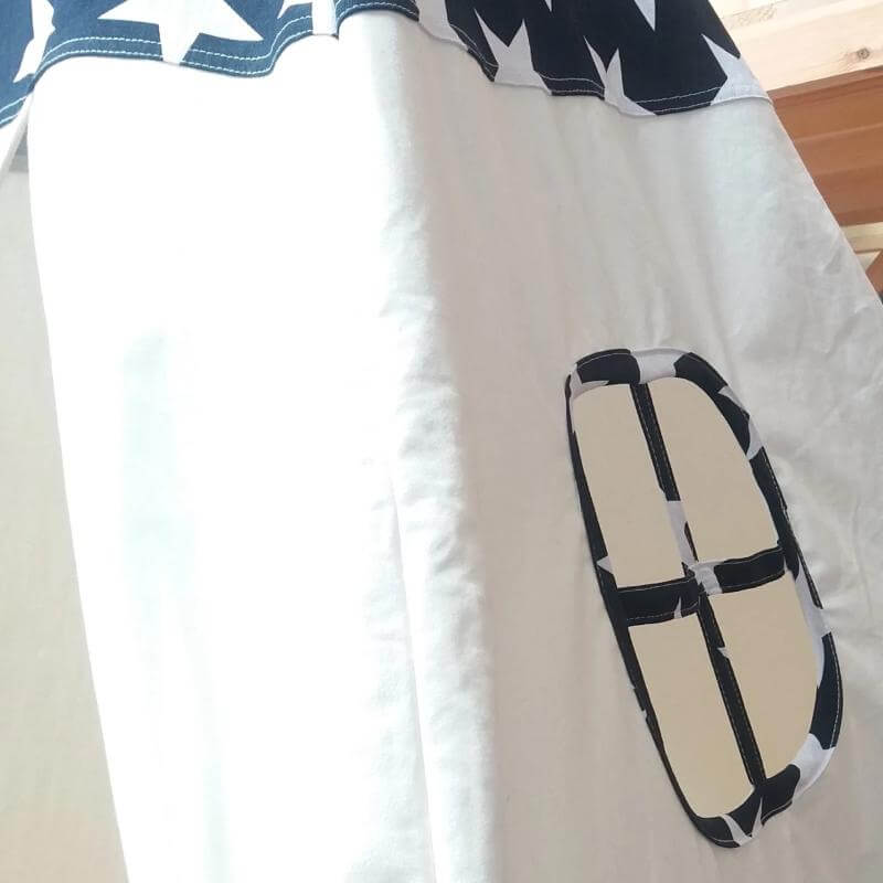 close up of the cotton teepee windows with navy & stars edging