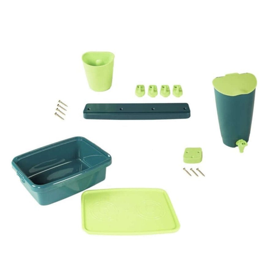 wooden bench with mud kitchen accessories in