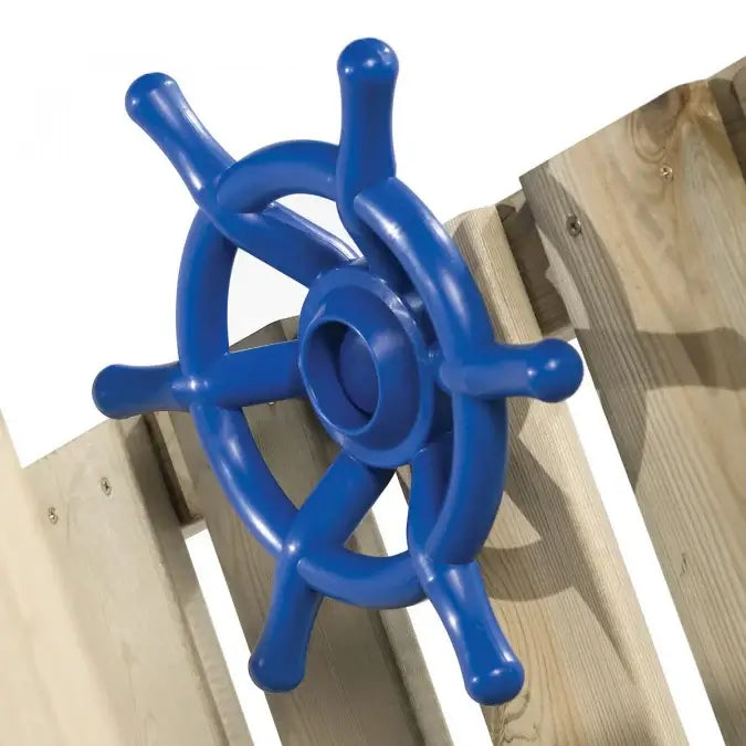 Blue boat style playground steering wheel on a wooden fence