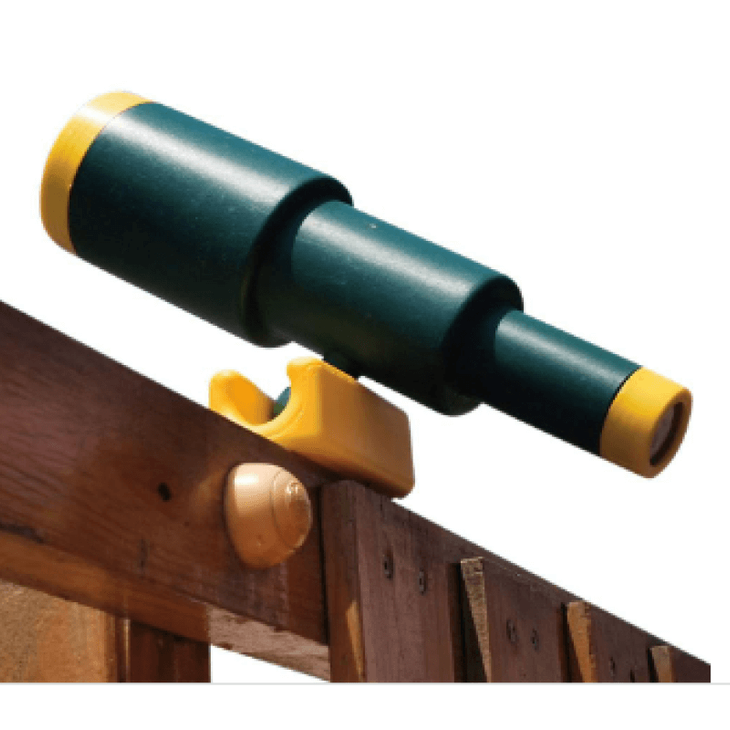 green and yellow playground telescope on  a wooden fence