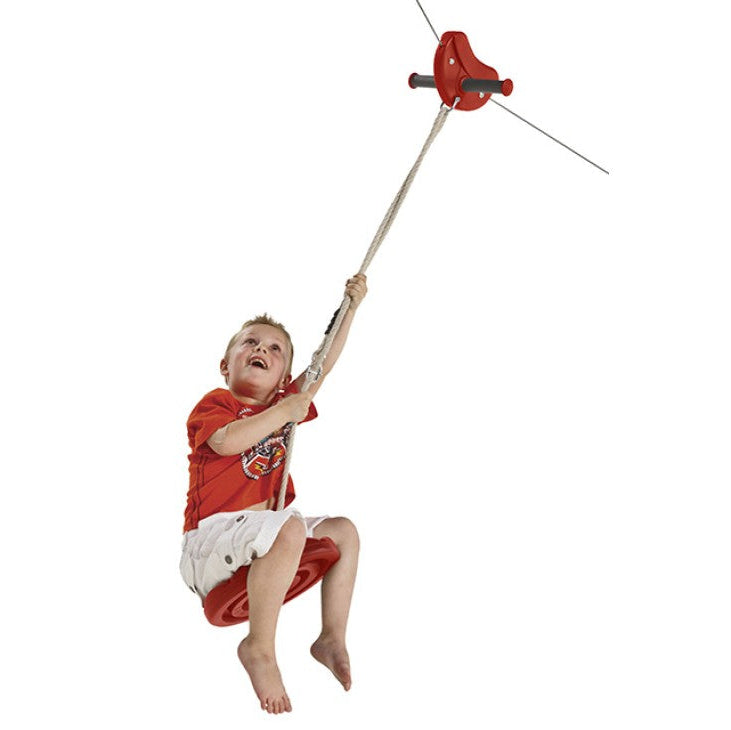 a boy having fun on the red zip line and monkey swing