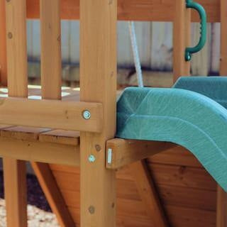 green slide attachment to wooden playground nz