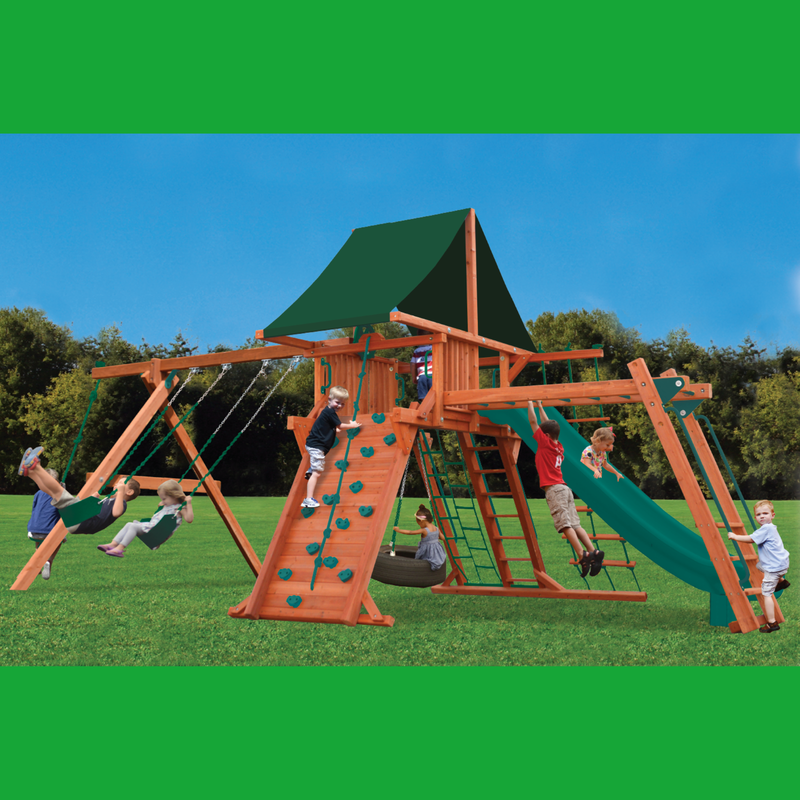 Children playing on a wooden playground set with green slides and swings against a blue sky.