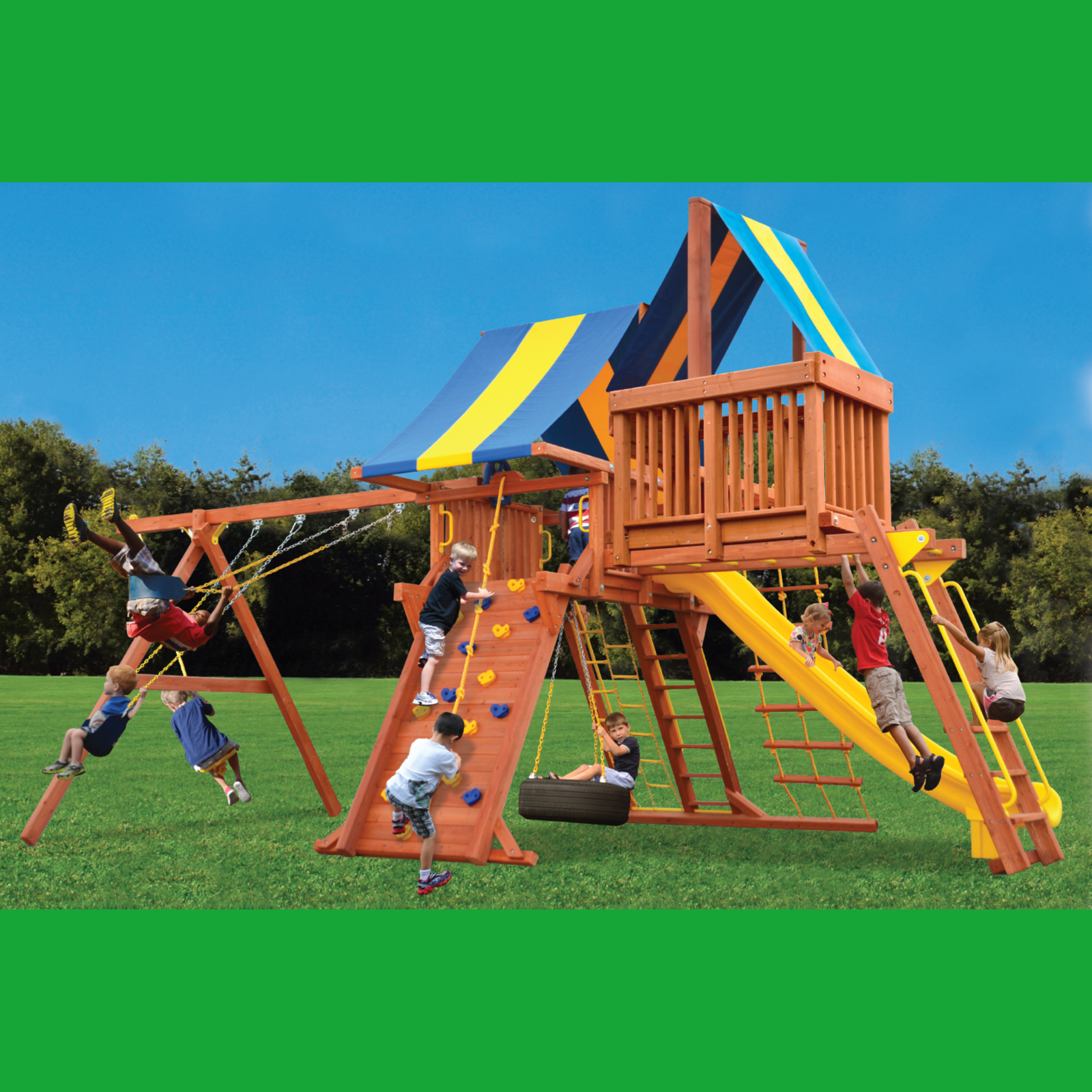 Children playing on a wooden playground set with monkey bars, slides and swings against a blue sky.
