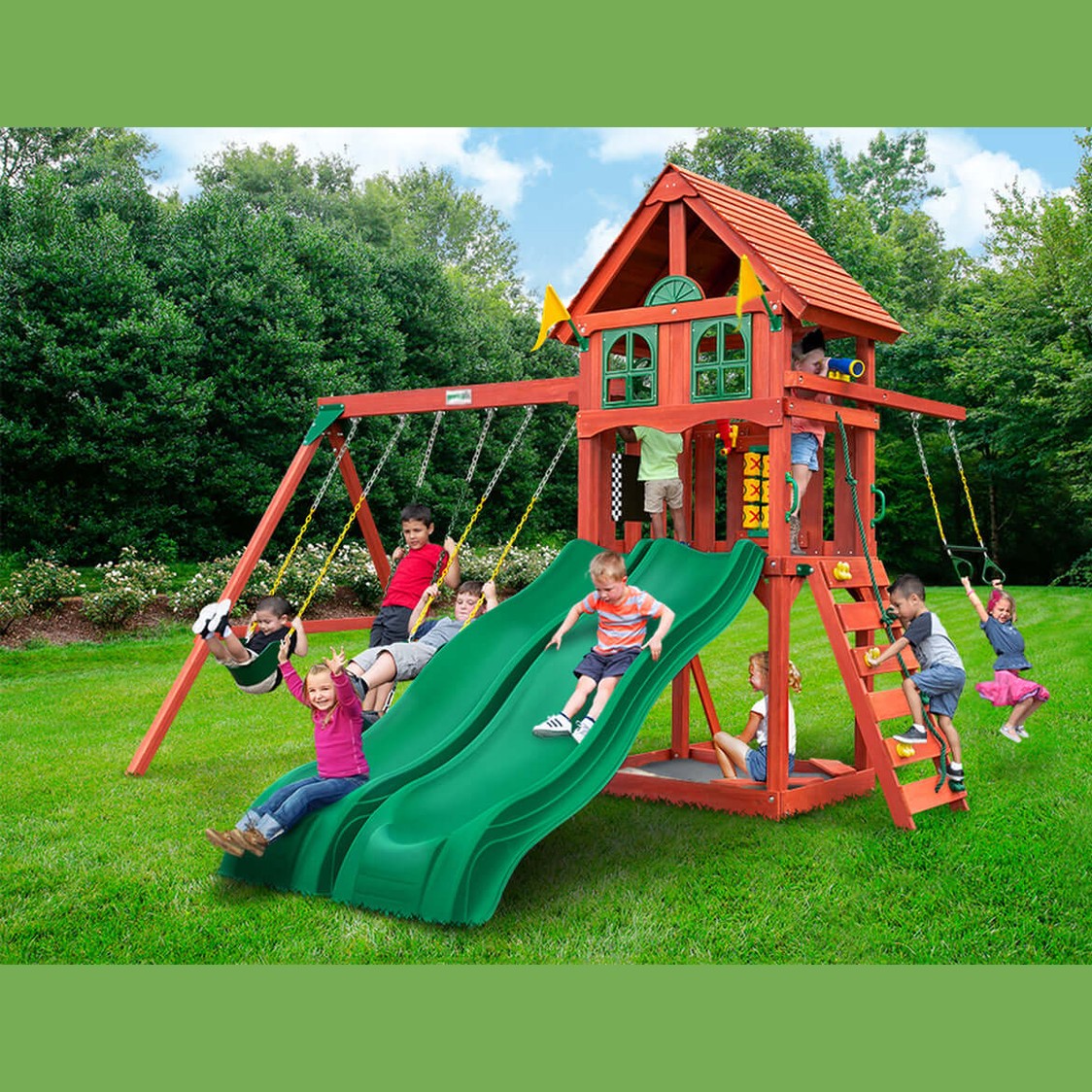Children playing on a red playset with green slide in nz backyard